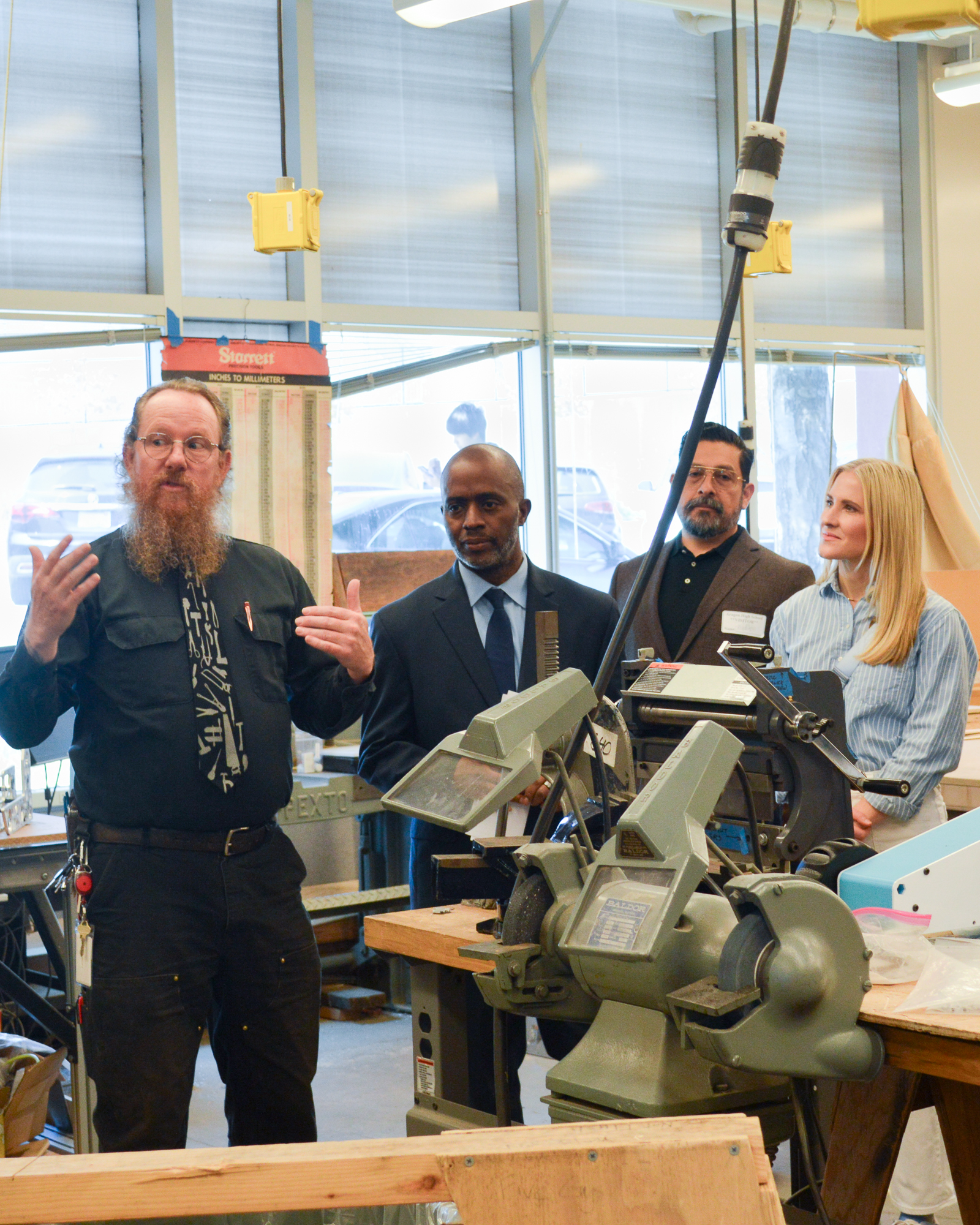 Jennifer Jacobson touring the Aragon High trades classroom
