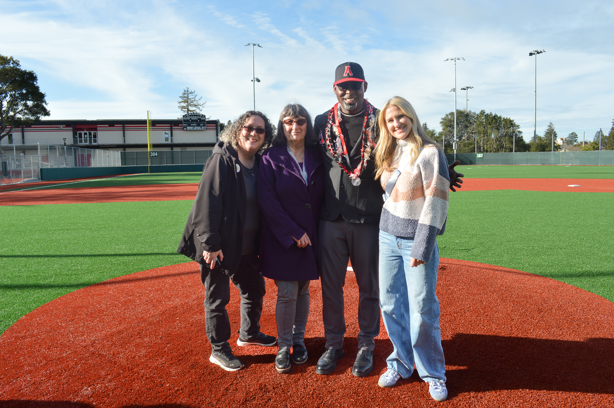 Jennifer Jacobson with Trustee Teri Chavez, Linda Lees Dwyer, and Superintendent Mike Jones at the Aragon baseball field